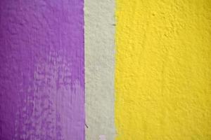 Colored painted wall with stripes. Wall art object with multicolored objects. photo