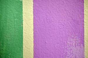 Colored painted wall with stripes. Wall art object with multicolored objects. photo