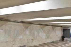 Underground passage in the city. The underground passage is lined with stone. photo