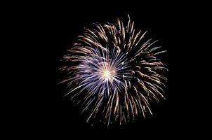 gold and blue fireworks on a black background. Preparation for further work. Screen overlay. Bright and colorful illustration for design. photo