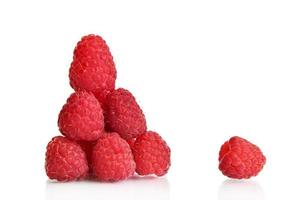 Ripe raspberries lined with a slide and one separate berry isolated on a white background. Element for design. Food clipart photo