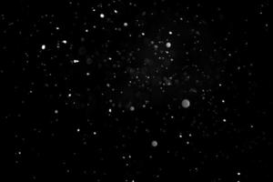 Defocused Snowing or raindrops on a dark background. Overlay photo