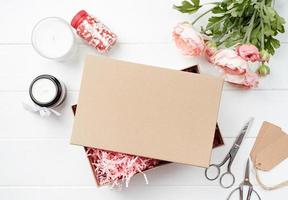 Shredded pink paper packing material texture in a craft box, mockup design photo