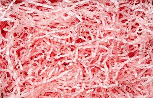 Shredded pink paper packing material texture photo