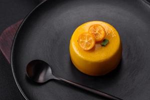 Delicious fresh tartlet with citrus filling and decorated with passion fruit photo