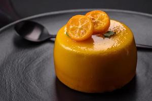 Delicious fresh tartlet with citrus filling and decorated with passion fruit photo