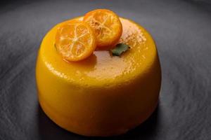 Delicious fresh tartlet with citrus filling and decorated with passion fruit photo