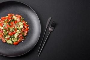 Delicious juicy fresh salad of tomatoes, peppers, cucumber, microgreens and sprouted mung bean photo