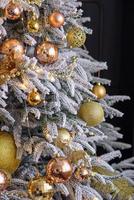 Beautiful Christmas tree with garlands, balls and toys photo
