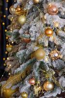 Beautiful Christmas tree with garlands, balls and toys photo