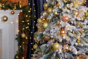 Beautiful Christmas tree with garlands, balls and toys photo