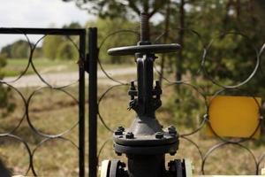 Yellow gas pipes and valves outdoors. gas equipment. Copy space for text. High quality photo