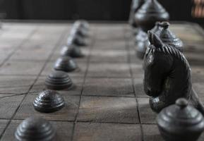 Ancient chess pieces made of wood photo