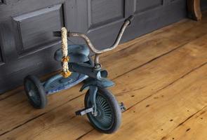 Old and rusted tricycle photo