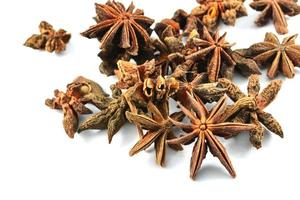 Chinese spice star anise fruit isolated on white background Star aniseed Badian khatai photo