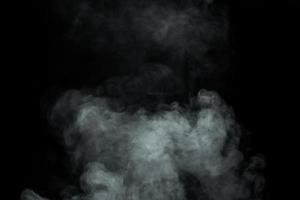 Abstract  powder or smoke isolated on black background photo