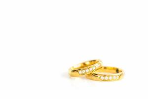 Close up gold rings on white photo
