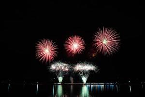 Abstract colored firework new year festival night sky background. photo