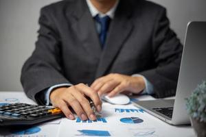 Businessperson document charts and graphs report statistic marketing and accounting showing the results of their successful. photo