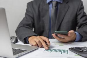 Businessperson document charts and graphs report statistic marketing and accounting showing the results of their successful. photo