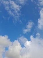 blue sky with puffy clouds background. Natural background. photo