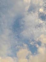 Beautiful white clouds on deep blue sky background. Elegant blue sky picture in daylight. Large bright soft fluffy clouds are cover the entire blue sky. photo