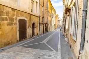 View of streets. Cozy idyllic street with doors and colorful walls. Traditional south, Mediterranean buildings and narrow streets photo