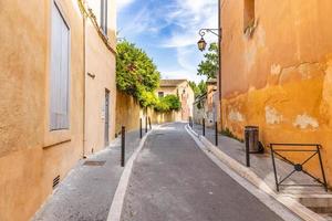 View of streets. Cozy idyllic street with doors and colorful walls. Traditional south, Mediterranean buildings and narrow streets photo