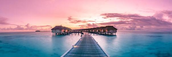 Amazing panorama beach landscape. Maldives sunset seascape view. Horizon with sea and sky. Tranquil scenery, tourism and travel banner. Summer luxury resort landscape, vacation holiday island concept