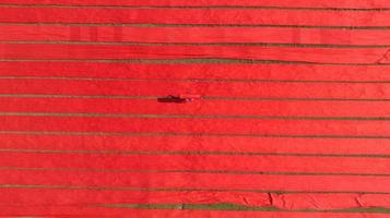 Drying red fabric in Bangladesh photo