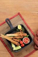 Sate Lilit, Minced Seafood Satay Made from Tuna Fish and Other Spicy ingredients. photo