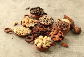 Various Nuts, Seed, Raisin on Wooden Bowl,