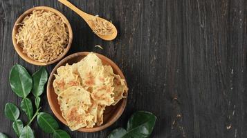 Rempeyek or Peyek Rebon is a Deep Fried Savoury Javanese Cracker Made from Rice flour and Udang Rebon. photo