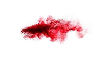 Red powder explosion on white background. photo