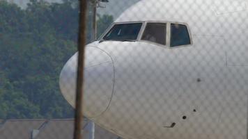 PHUKET, THAILAND NOVEMBER 29, 2017 - NordWind Airlines Boeing 777 VP BJH taxiing before departure from Phuket airport. video