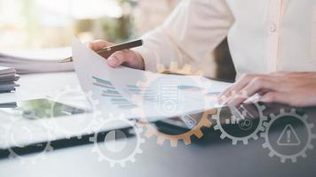 Businessman Audit documents, quality assessment management With a checklist, business document evaluation process, market data report analysis and consulting, plan review process,Document Management photo