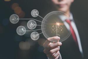 solution concept and demonstrating leadership strategies,that lead the business in a successful direction,with innovation and brain power from brainstorming,businessman holding a key photo