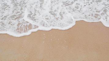 Slow motion foam wave on the beach. Cloudy rainy. Cloudy rainy weather. Rayong, Thailand video