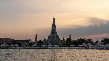 Time Lapse of Wat Arun at Sunset with View of Chao Phraya River and water Transportation video