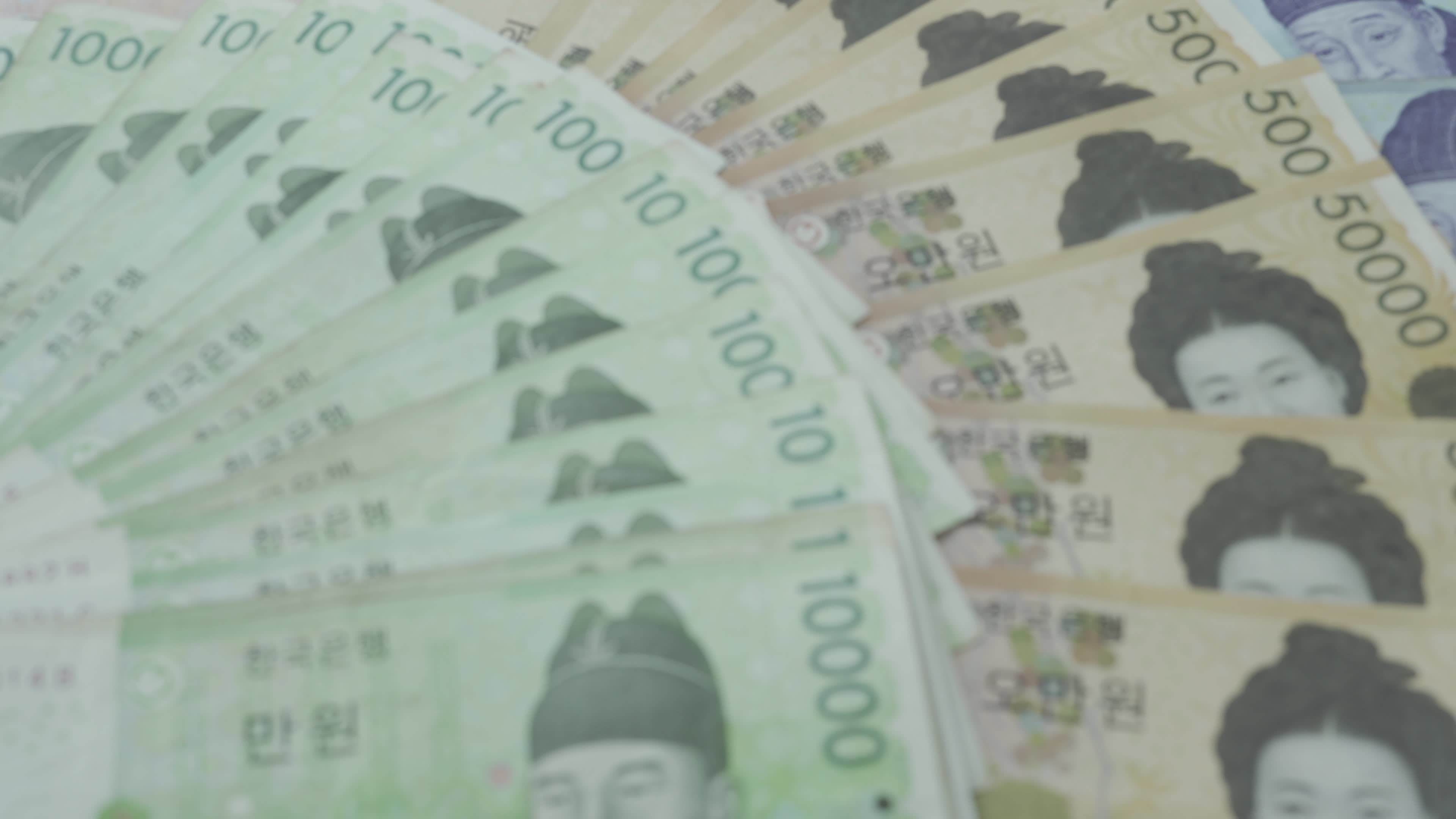 Korean Currency Many Korean Bank Notes Placed On The Table The Won Is 