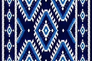 patrón étnico ikat sin costuras en tribal. estampado de adornos étnicos geométricos aztecas. estilo de patrón ikat. vector