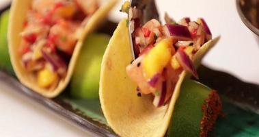 Vegan Tacos With Delicious Salsa Fillings Made Of Chopped Tomatoes, Onions, And Ripe Mangoes Seasoned With Sesame Seeds - close up video