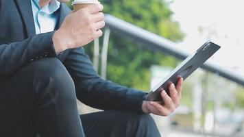 Businessman using tablet analyzing sales data and economic growth graph chart. Business strategy. Abstract icon. Digital marketing. video