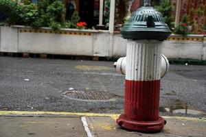 Little italy new york buildings italian flag green white and red hydrant photo