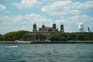 ellis island new york view cityscape from hudson river liberty island photo