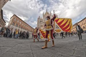 SIENA, ITALY - MARCH 25 2017 - Traditional flag wavers parade photo
