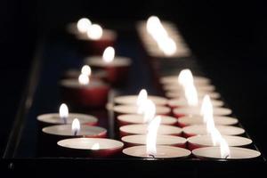 church votive candles white flames photo