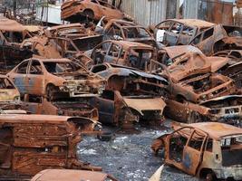 junkyard old rusted car field photo