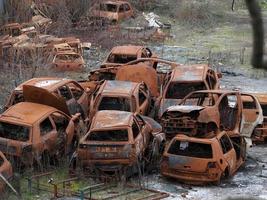 junkyard old rusted car field photo