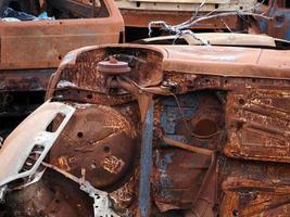 junkyard old rusted car field photo